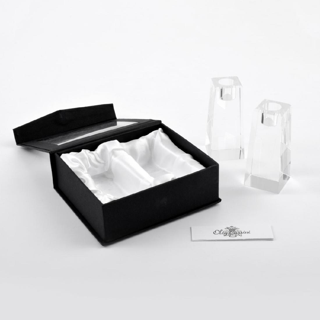 Pair of Oleg Cassini KELLY Candlesticks: Designer/Artist & Manufacturer: Oleg Cassini Markings: signed, marking(s) Country of Origin & Materials: USA; crystal Additional Information: Lot includes the original box. Dimensions(H,W,D): candlest