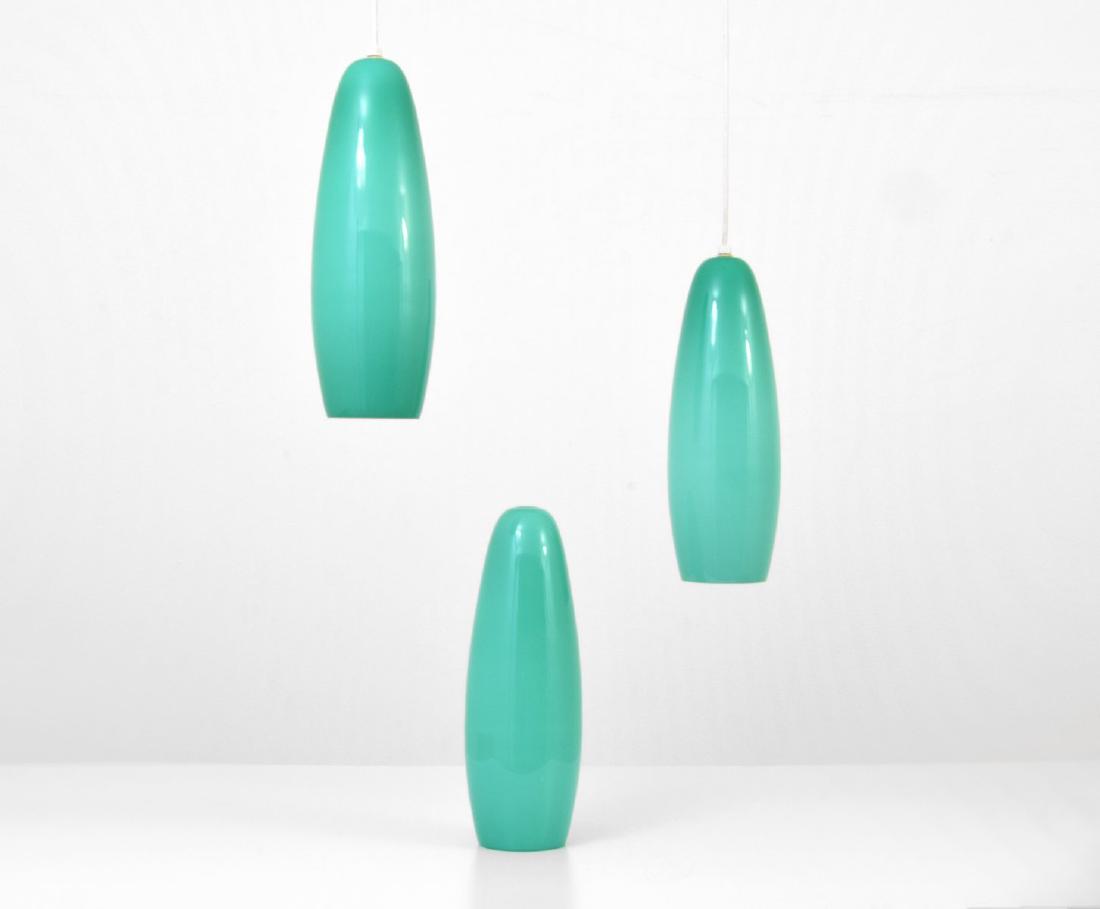 Vistosi Pendant Lamps, Set of 3: Designer/Artist & Manufacturer: Vistosi Markings: no marking(s) apparent Country of Origin & Materials: Italy; glass Additional Information: 20th Century Design Dimensions(H,W,D): 17.5"h, 5"dia