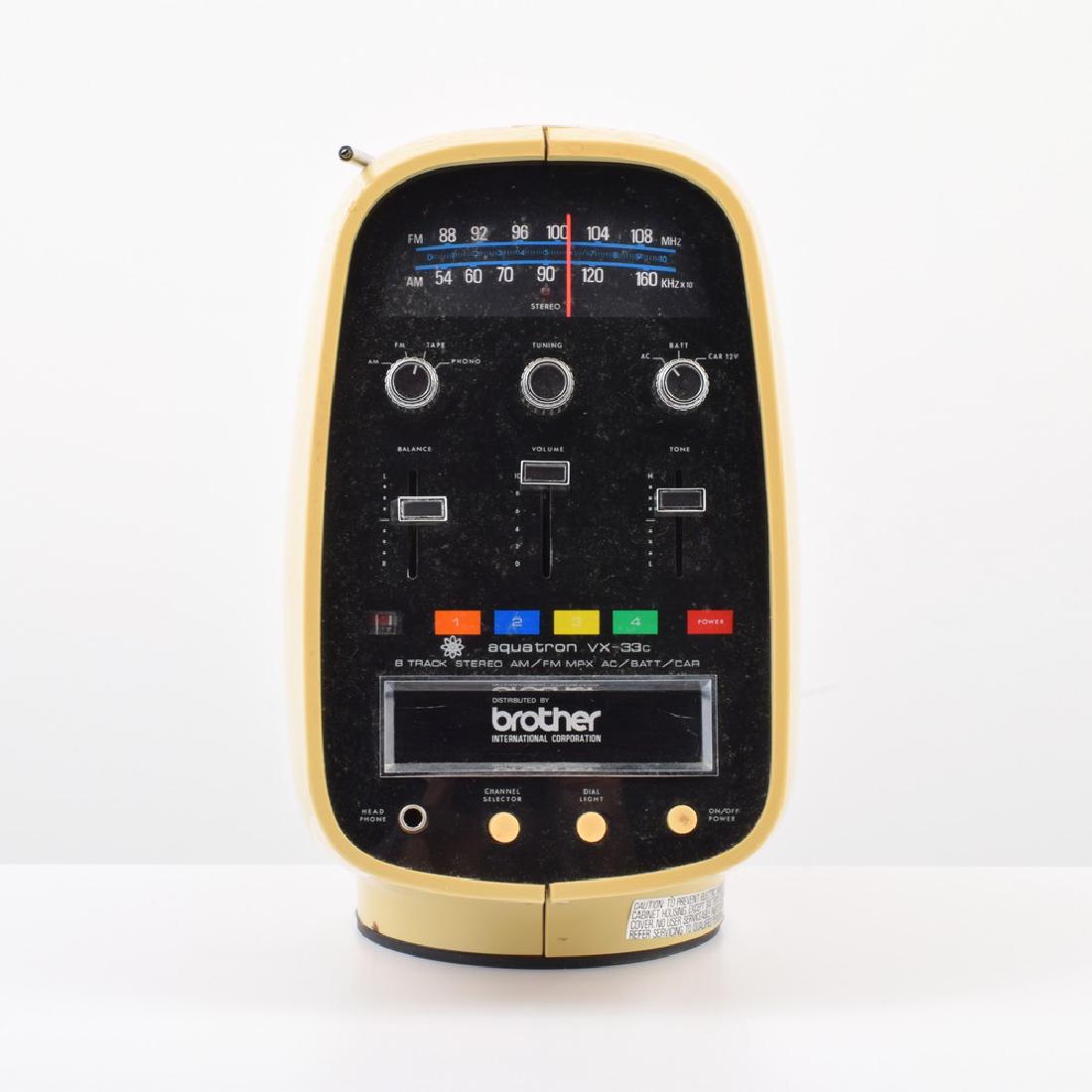 Aquatron VX-33c Radio & 8 Track Player: Designer/Artist; Manufacturer: Aquatron; Distributed by Brother International Corp. Markings: marking(s) Country of Origin & Materials: USA; plastic, metal, other Additional Information: Collectibles