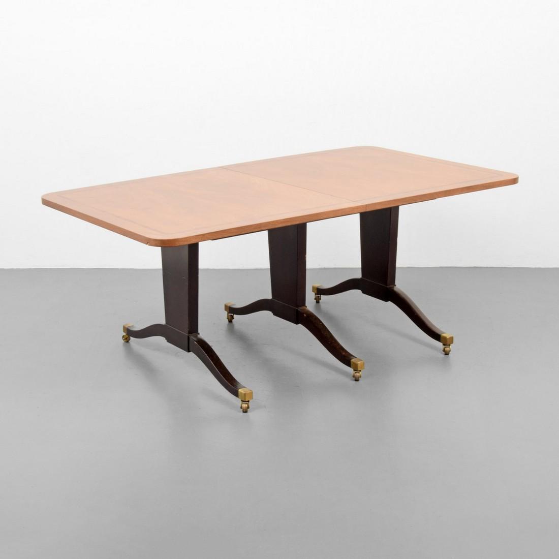 Large Edward Wormley Dining Table: Designer/Artist; Manufacturer: Edward Wormley; Dunbar Markings: remnants of Dunbar label Country of Origin & Materials: USA; wood, brass Additional Information: Wheeled dining table has two 20" leaves