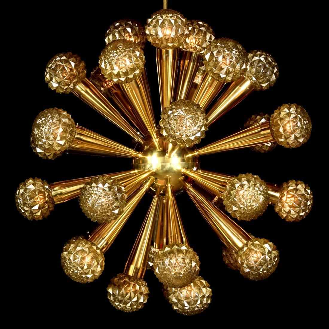 Massive Starburst Chandelier, 46"dia: Designer/Artist; Manufacturer: unknown Markings/Notes: no marking(s) apparent Country of Origin & Materials: country of origin unknown; brass, glass Additional Information: Chandelier has thirty light
