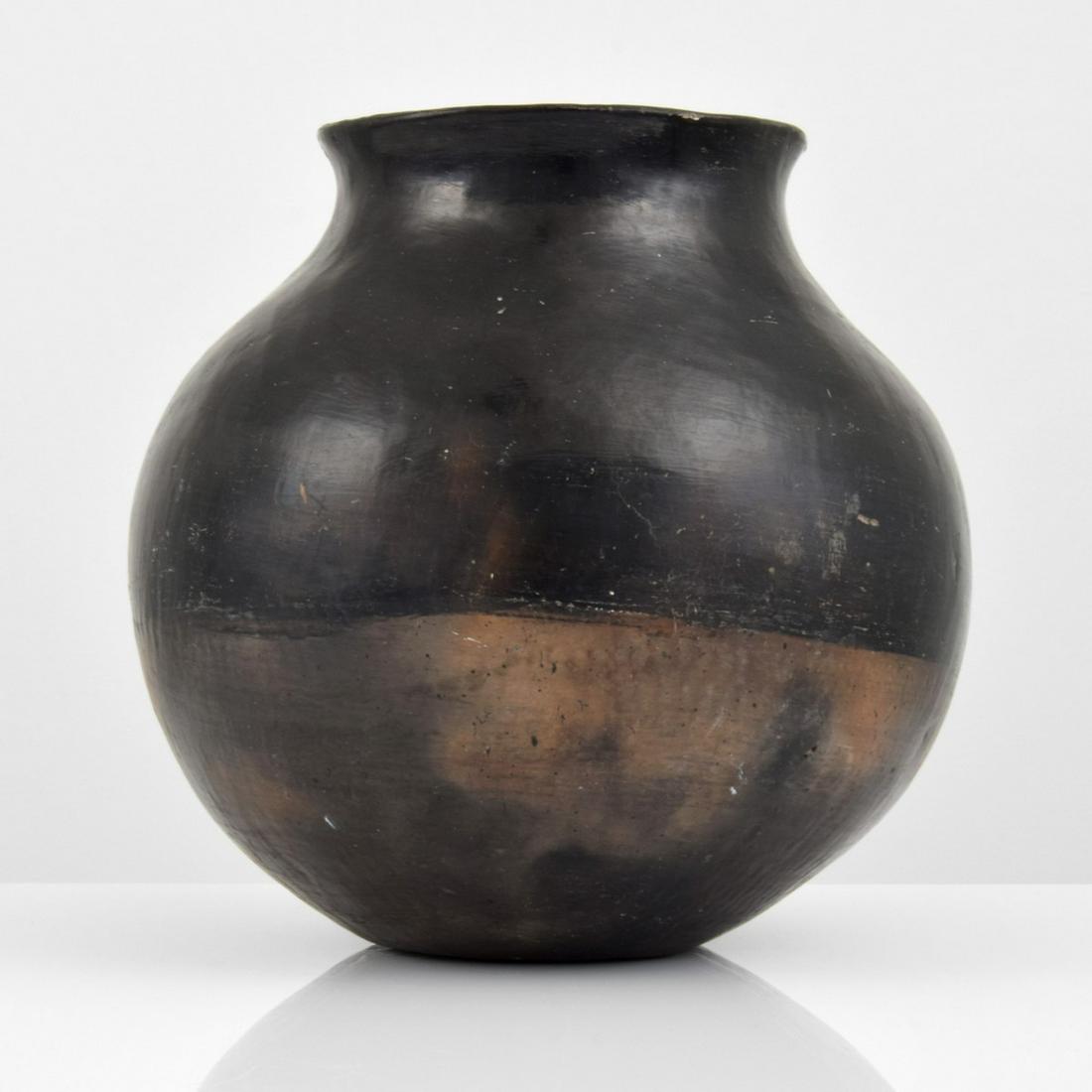 San Juan Blackware Olla Native American Vessel: Designer/Artist; Manufacturer: San Juan Pueblo, New Mexico Markings/Notes: no marking(s) apparent Country of Origin & Materials: American; blackware Additional Information: Provenance: Larry Franks, S