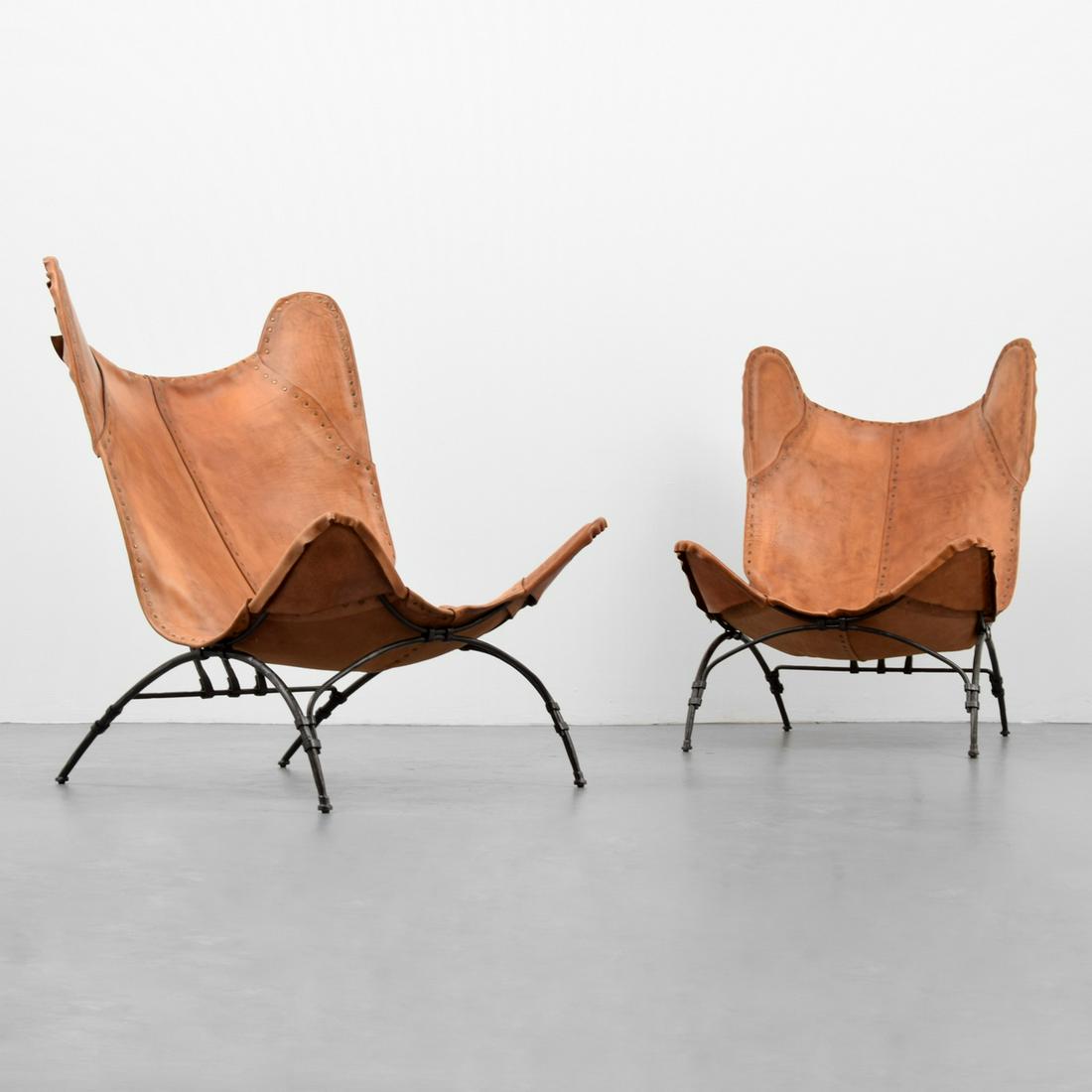 Pair of Ralph Lauren "Safari Camp" Chairs: Designer & Manufacturer: Ralph Lauren Markings/Notes: Ralph Lauren imprint Country of Origin & Materials: USA; iron, leather Dimensions(H,W,D): 39"h, 30"w, 35"d; 19" front peak Additional Information