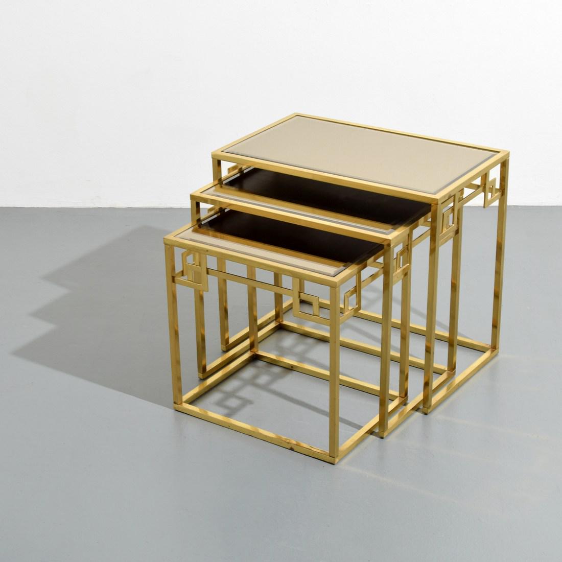 Mastercraft Greek Key Stacking Tables, Set of 3: Designer/Artist; Manufacturer: Mastercraft Markings/Notes: markings to glass Country of Origin & Materials: USA; brass, smoked mirror Additional Information: Video preview available for all lots in ou