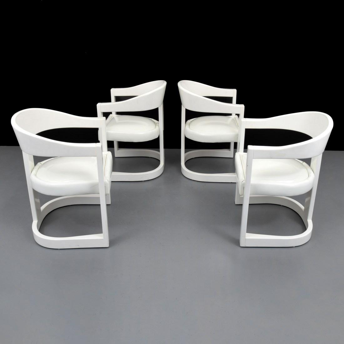 Karl Springer "Onassis" Armed Dining Chairs, Set of 4: Designer/Artist; Manufacturer: Karl Springer; Karl Springer Ltd. Markings/Notes: no marking(s) apparent Country of Origin & Materials: USA; patent leather, enamel on wood Additional Information: Refer