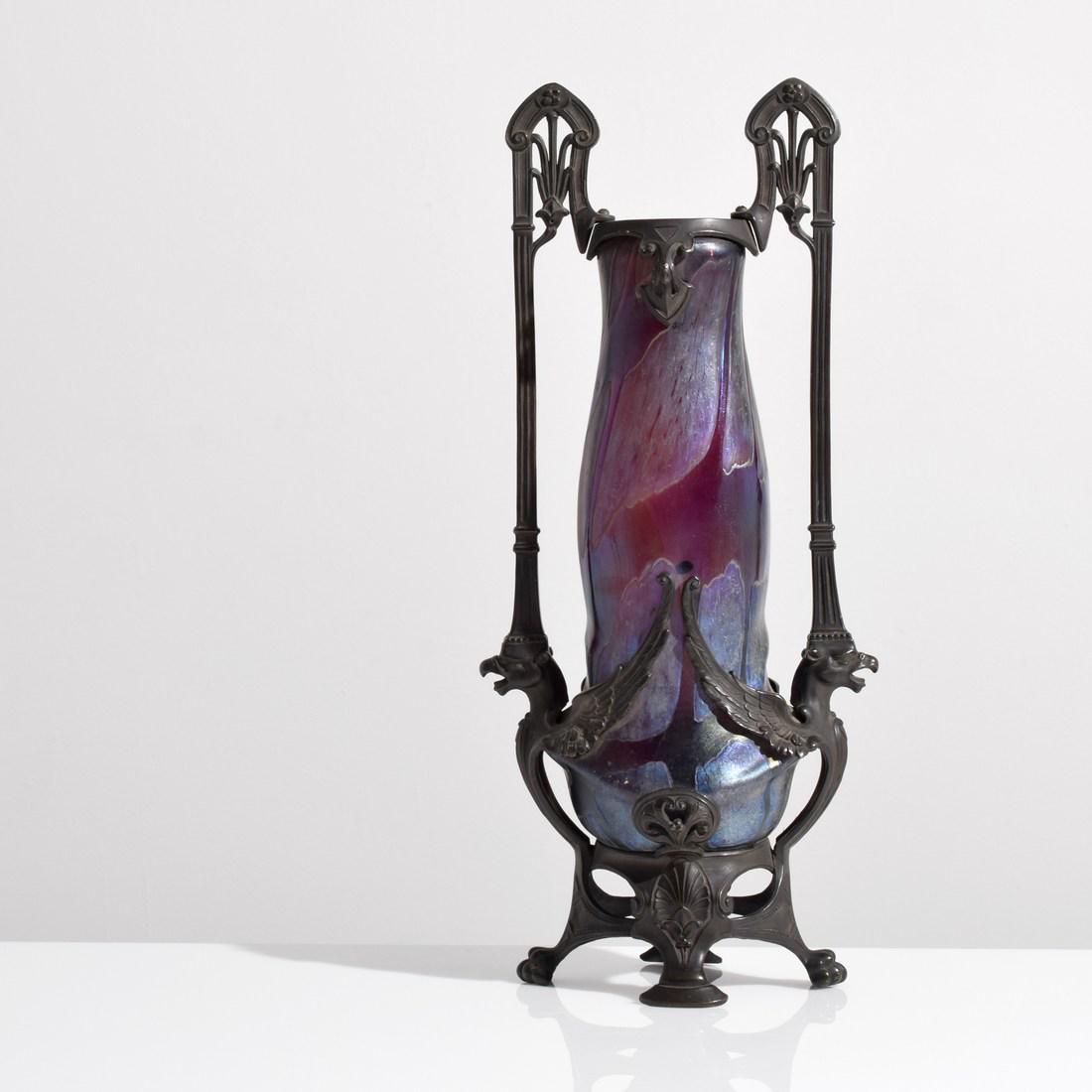 Art Nouveau Vase in Stand Attributed to Loetz: Designer/Artist; Manufacturer: Loetz, attributed Markings/Notes: no marking(s) apparent Country of Origin & Materials: Austria; glass, metal Additional Information: Provenance: Estate of London galler