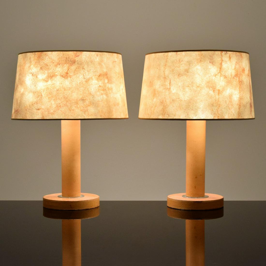 Pair of Peter Marino Leather Lamps: Artist/Designer; Manufacturer: Peter Marino Marking(s); notes: Peter Marino label Country of origin; materials: USA; leather, parchment, metal Description: Lamps in the manner of Paul Dupre-Lafon have