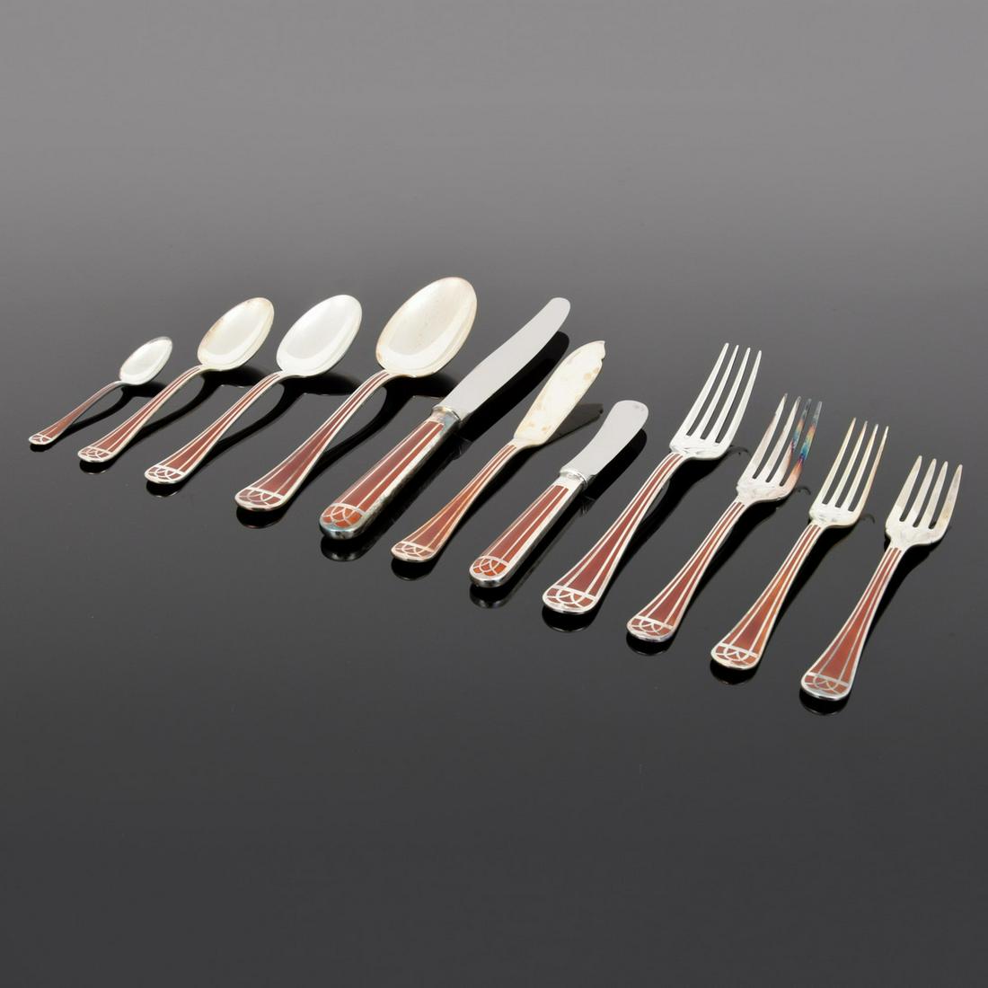 Christofle "Talisman" Sienna Flatware Service, 132: Artist/Designer; Manufacturer: Christofle Marking(s); notes: Christofle imprints Country of origin; materials: France; stainless steel, silver-plate, Chinese lacquer Description: "No rule of etiquette