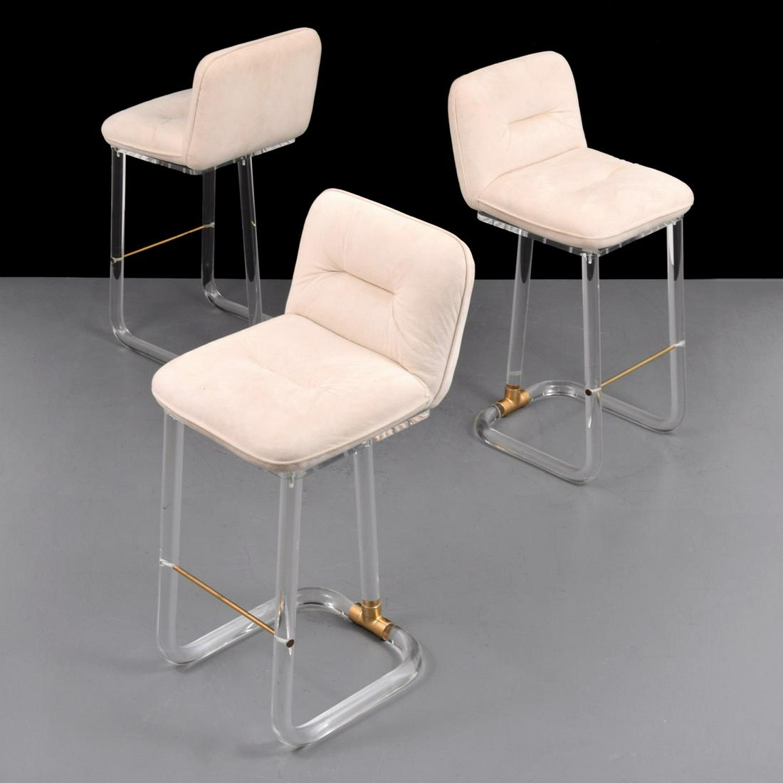 Lion in Frost Swivel Bar Stools, Set of 3: Artist/Designer; Manufacturer: Leon Frost; Lion In Frost Marking(s); notes: signed Country of origin; materials: USA; Lucite, upholstery, brass Dimensions (H, W, D): 40"h, 18"w, 18"d; 30" seat height 