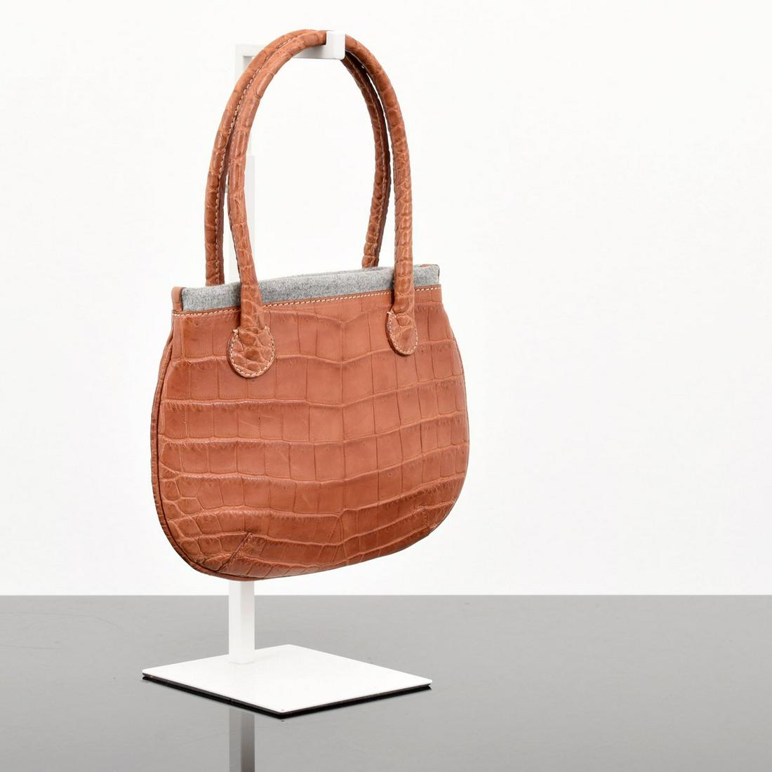 Brunello Cucinelli Handbag: Artist/Designer; Manufacturer: Brunello Cucinelli Marking(s); notes: Brunello Cucinelli label and tag Country of origin; materials: Italy; leather, jersey Dimensions (H, W, D):