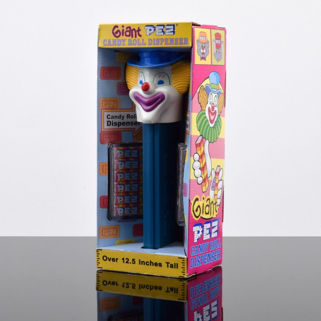 Giant PEZ Vintage Peter Clown Dispenser, 12.5": Artist/Designer; Manufacturer: PEZ Candy, Inc. Marking(s); notes: marking(s); 1999 Country of origin; materials: USA (candy), China (dispenser); plastic, cardboard Dimensions (H, W,