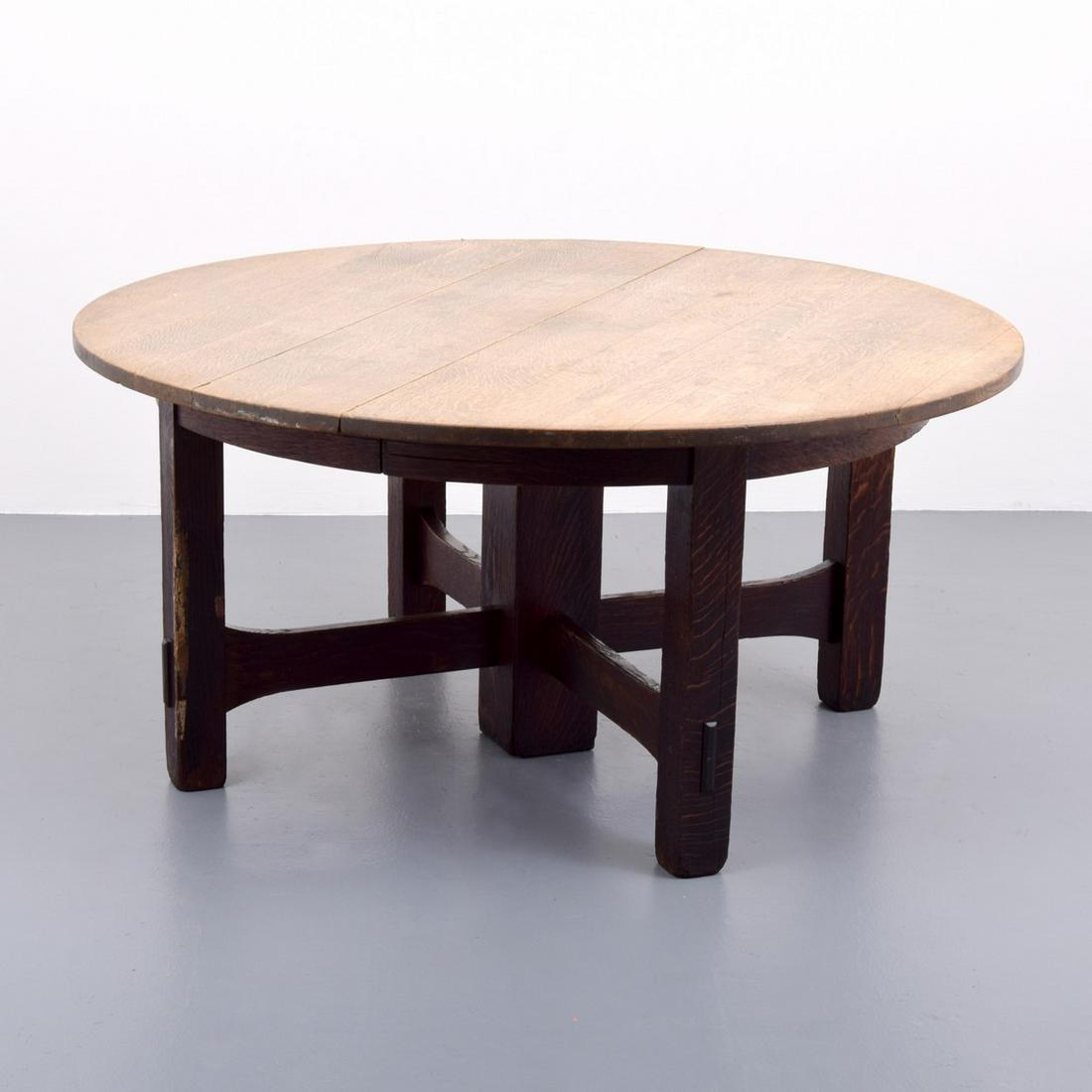 Gustav Stickley 5-Leg Dining Table: Artist/Designer; Manufacturer: Gustav Stickley Marking(s); notes: remnants of Stickley label Country of origin; materials: USA; oak Dimensions (H, W, D): 28.5"h, 59.5"dia