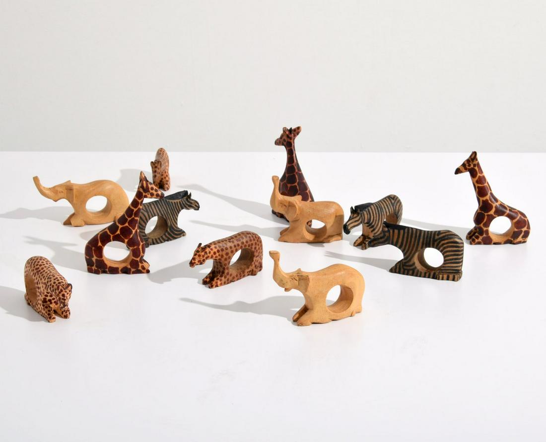 12 African Napkin Holders, Paige Rense Noland Estate: Artist/Designer; Manufacturer: unknown Marking(s); notes: labels Country of origin; materials: Africa; wood Dimensions (H, W, D): approx. 3-5" each Additional Information: This lot is from the Palm Be
