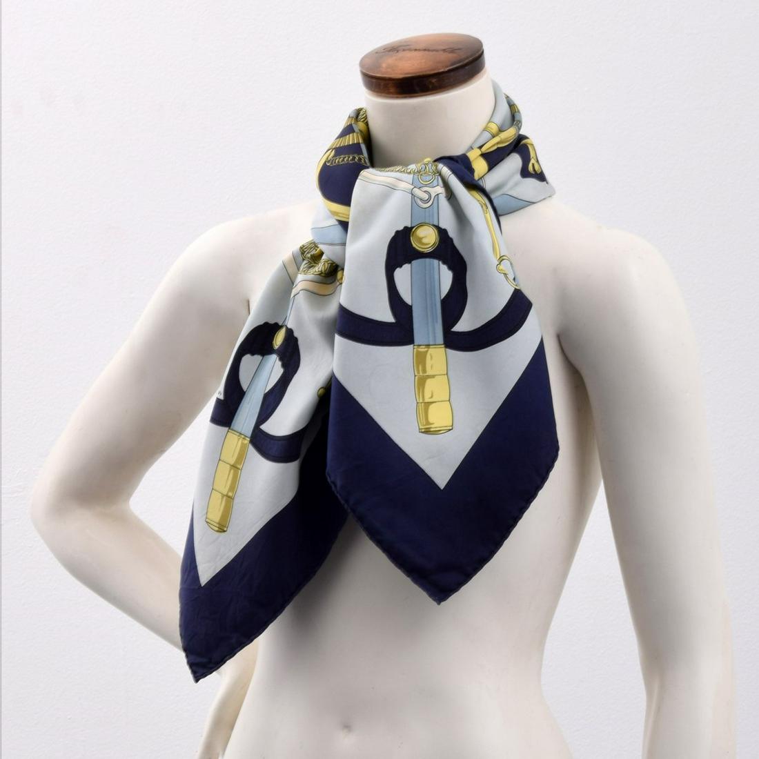 Hermes "Eperon D'Or" Silk Scarf, Paige Rense Estate: Artist/Designer; Manufacturer: Henri d'Origny; Hermes Marking(s); notes: signed in design (Hermes, artist, title) Country of origin; materials: France; silk Dimensions (H, W, D): 35"l, 35"w Additional