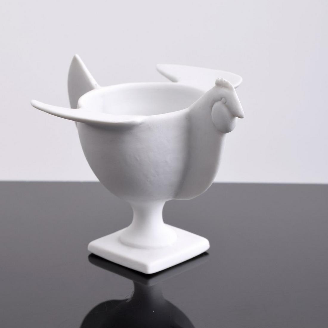 Francois-Xavier Lalanne "Coquetier Poule" Egg Cup: Artist/Designer; Manufacturer: Francois-Xavier Lalanne (1927-2008); Porcelaine de Paris/Artoria Marking(s); notes: signed Country of origin; materials: French; porcelain Dimensions (H, W, D): 3"h, 3.5