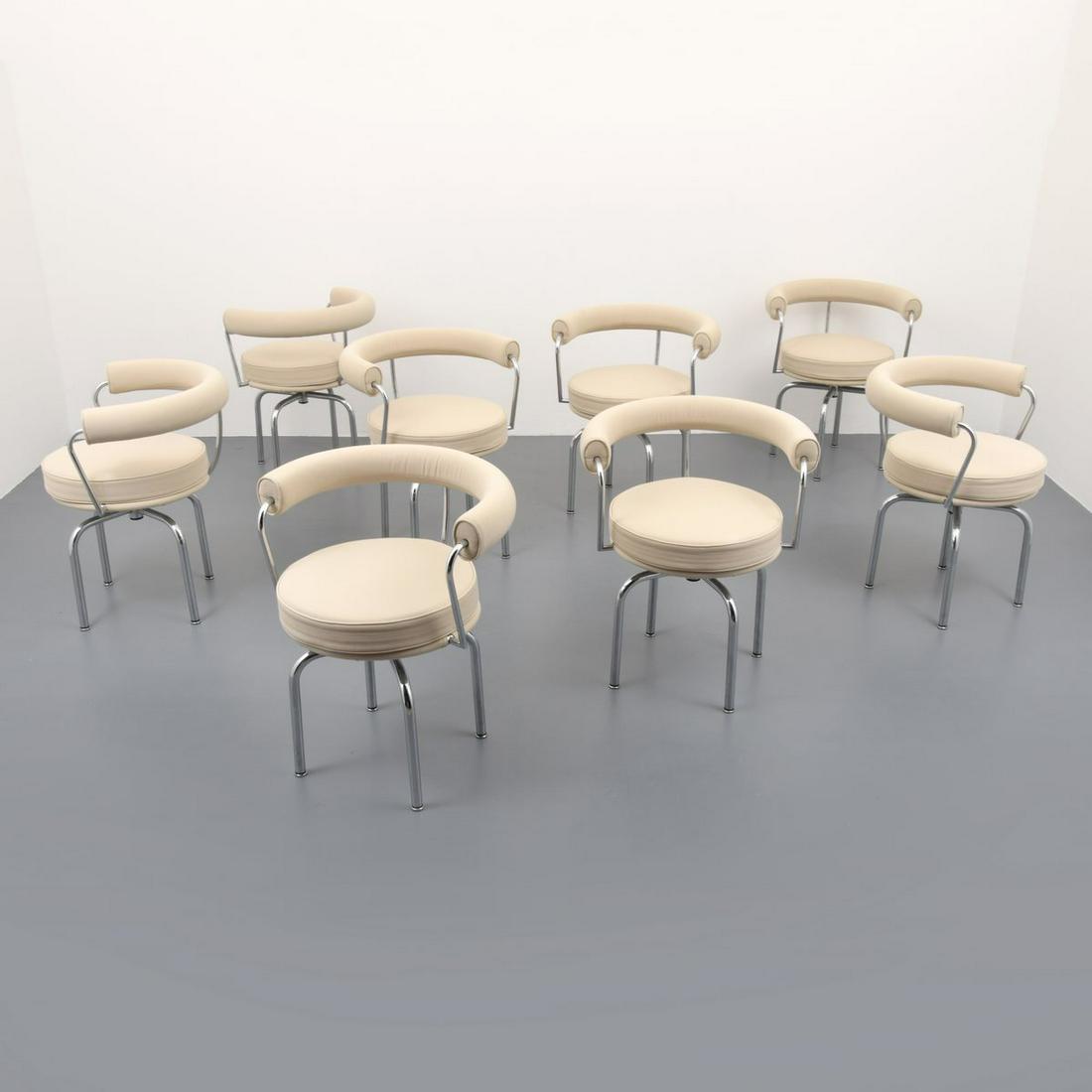 8 Jeanneret, Perriand & Le Corbusier Dining Chairs: Artist/Designer; Manufacturer: Pierre Jeanneret, Charlotte Perriand, Le Corbusier; Cassina Marking(s); notes: signed, numbered, Cassina label Country of origin; materials: Italy; chromed metal, uphols
