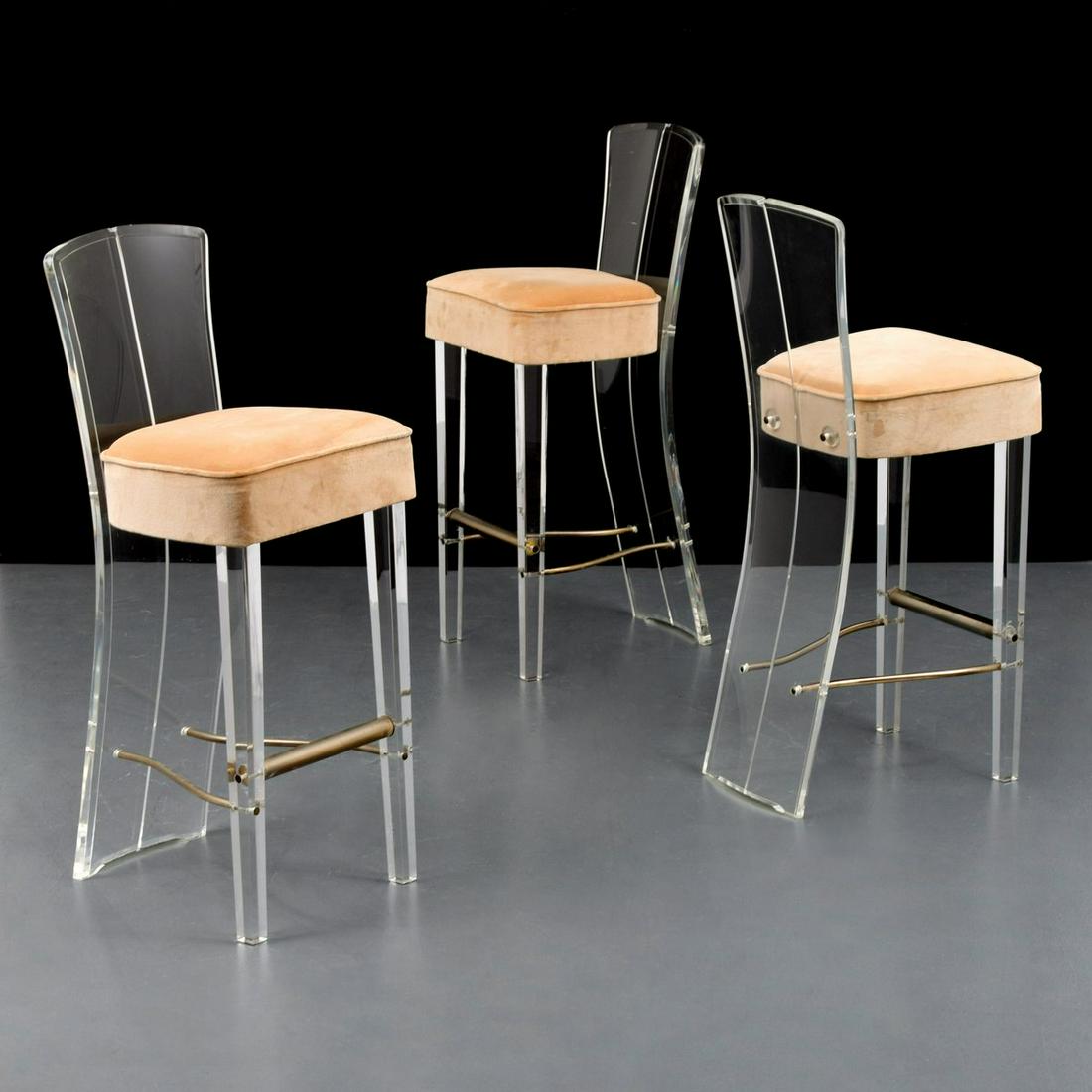 3 Hill Manufacturing Corp. Bar Stools: Artist/Designer; Manufacturer: Hill Manufacturing Corp. Marking(s); notes: Hill Manufacturing Corp. label Country of origin; materials: USA; Lucite, metal, upholstery Dimensions (H, W, D): 39.5"h, 16"