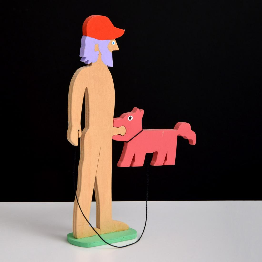 William Accorsi Erotic Puzzle Sculpture, Man & Dog: Artist/Designer; Manufacturer: William Accorsi (b. 1931) Marking(s); notes: signed, 2010 Country of origin; materials: American; painted wood Dimensions (H, W, D): 8"h, 5.5"w, 1.5"d Additional Informa