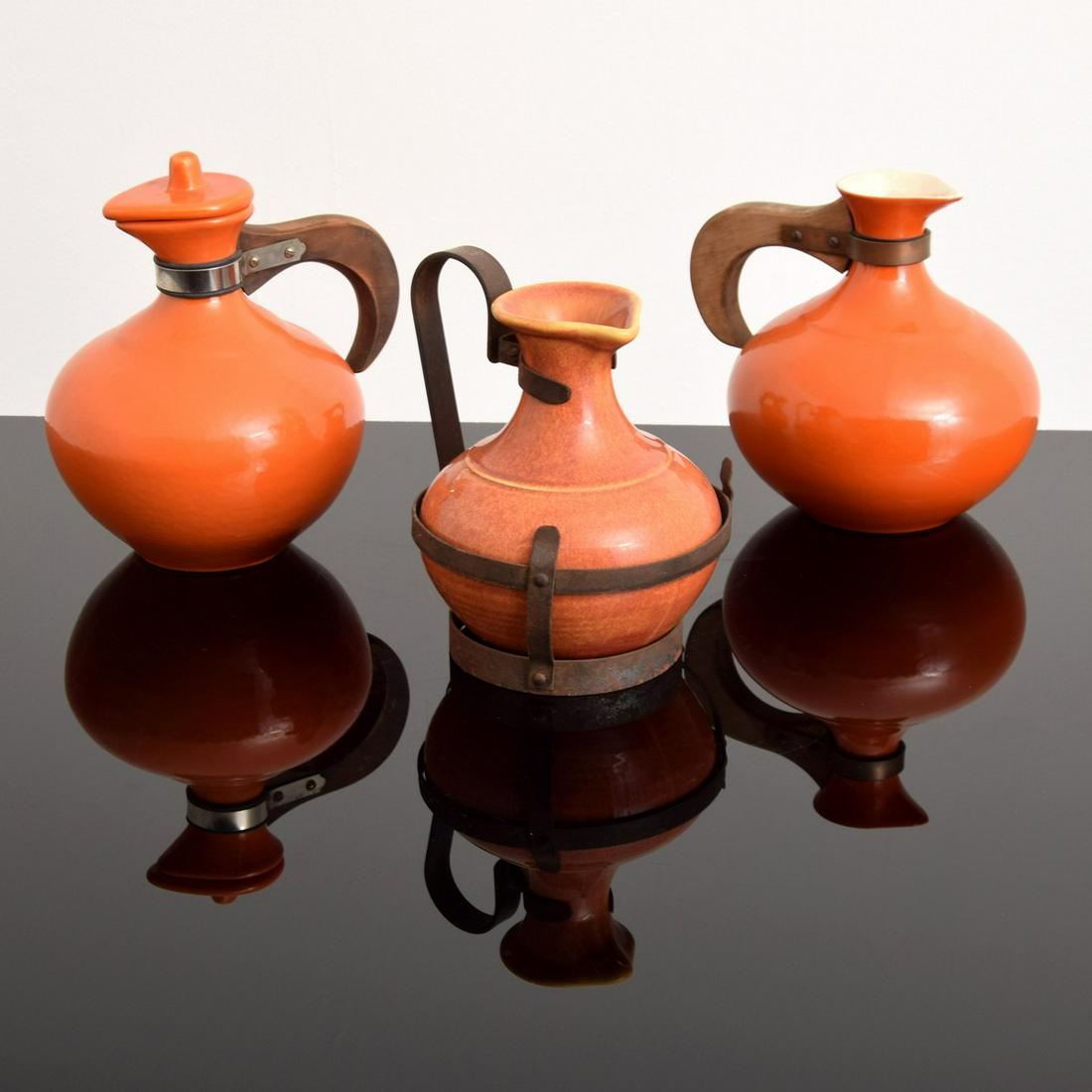 3 Carafes/Jugs, Manner of Bauer & Pacific Pottery Co.: Artist/Designer; Manufacturer: Bauer & Pacific Pottery Co., manner of Marking(s); notes: marking(s) Country of origin; materials: USA; ceramic Dimensions (H, W, D): tallest: 9"h, 9"w, 6"d Additional I