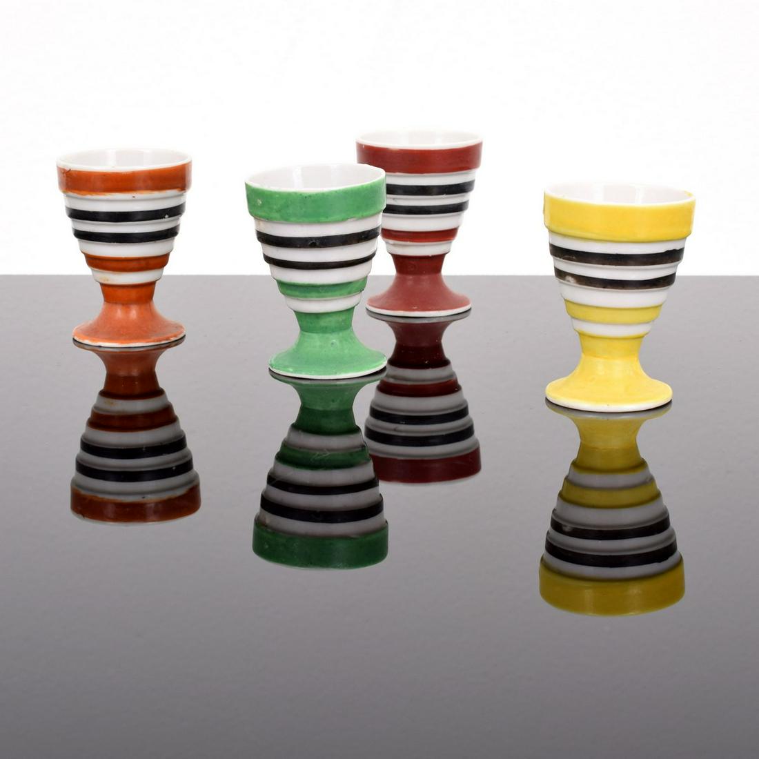 4 Vintage Egg Cups: Artist/Designer; Manufacturer: unknown Marking(s); notes: no marking(s) apparent Country of origin; materials: Japan; porcelain Dimensions (H, W, D): 2"h, 1.75"dia Additional Information: Collectibles