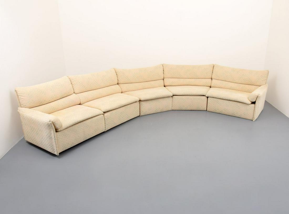 Saporiti Italia Curved Sectional Sofa: Artist/Designer; Manufacturer: Saporiti Italia Marking(s); notes: Saporiti Italia label and floor protectors Country of origin; materials: Italy; upholstery, plastic Dimensions (H, W, D): end 1: 29"h,