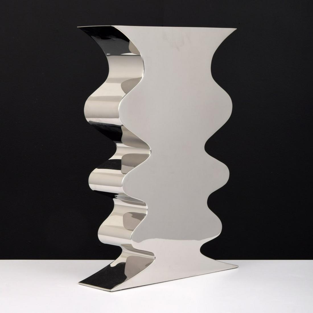 Large Stanley Jay Friedman "Puzzle" Vase: Artist/Designer; Manufacturer: Stanley Jay Friedman; Brueton Marking(s); notes: no marking(s) apparent Country of origin; materials: USA; chromed metal Dimensions (H, W, D): 20.75"h, 14.5"w, 4.25"d Ad