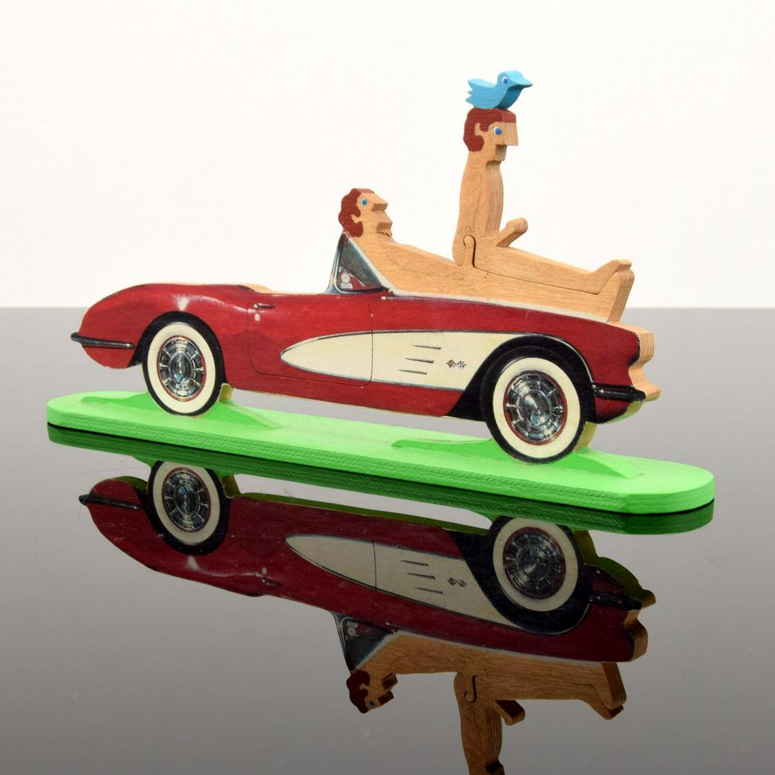 William Accorsi Homoerotic Sports Car Puzzle Sculpture: Artist/Designer; Manufacturer: William Accorsi (b. 1931) Marking(s); notes: signed D. Vinci; 2009 Country of origin; materials: American; painted wood Dimensions (H, W, D): 5.25"h, 10.25"w, 1.25"d Add