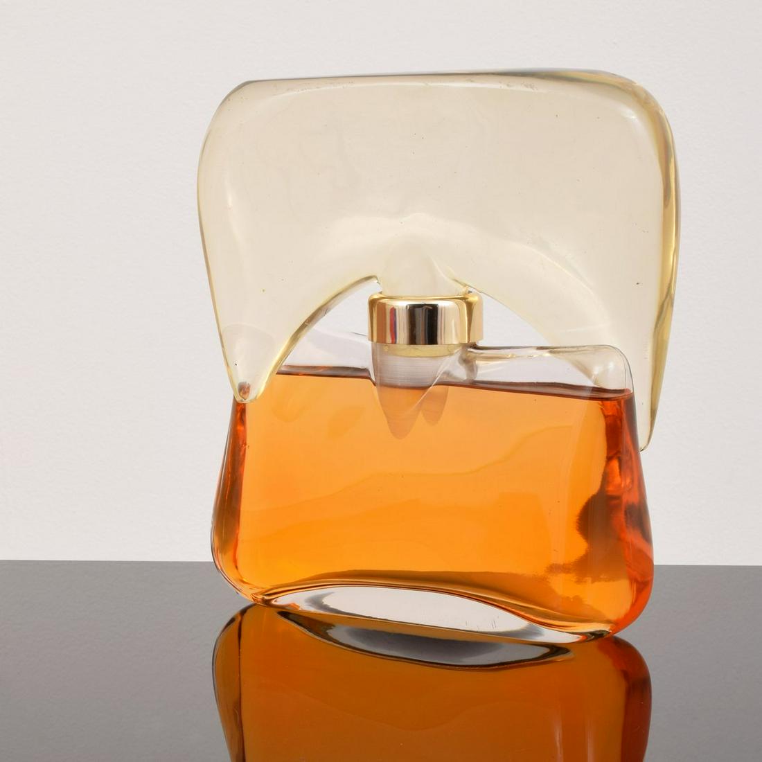 Guy Laroche Factice / Display Perfume Bottle: Artist/Designer; Manufacturer: Guy Laroche Marking(s); notes: marking(s) Country of origin; materials: France; glass, other Dimensions (H, W, D): 9.75"h, 8.25"w, 3"d Additional Information: Provenance