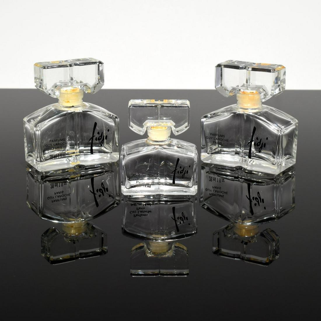 3 Guy Laroche "Fidji" Perfume Bottles: Artist/Designer; Manufacturer: Guy Laroche Marking(s); notes: labels, marking(s) Country of origin; materials: France; crystal Dimensions (H, W, D): largest: 2.75"h, 2.25"w, 1"d Additional Information