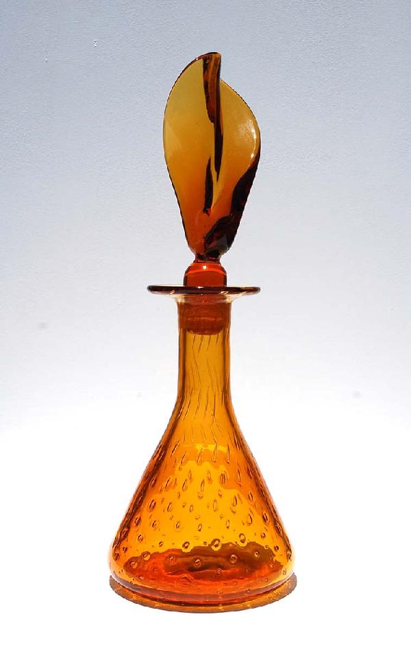 Decanter Attributed to Blenko: Designer & Manufacturer: Blenko Attributed Country of Origin & Materials: USA; Blown Glass Additional Information & Circa: Decanter attributed to Blenko; Circa 1960's Dimensions: 15.5"H, 5.5"Dia.