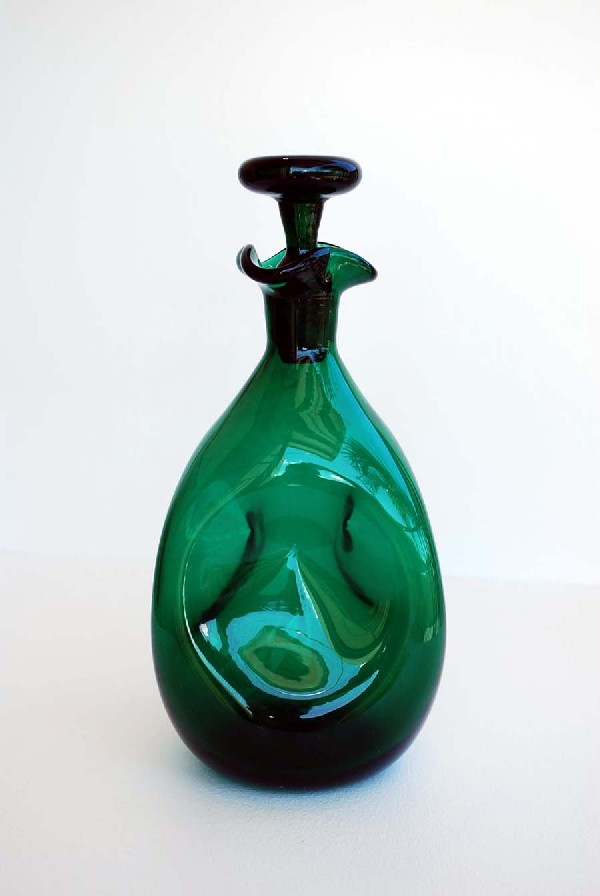 Blenko Decanter: Designer & Manufacturer: Blenko Country of Origin & Materials: USA; Blown Glass Additional Information & Circa: Blenko decanter, style #49; Circa 1960's Dimensions: 10.5"H, 4.5"-4.75"Dia.