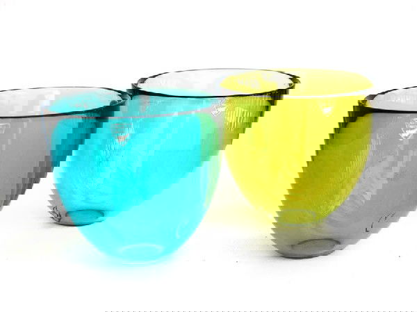 Pair of Orrefors Bowls: Designer & Manufacturer: Orrefors Country of Origin & Materials: Sweden; Blown Glass Additional Information & Circa: Pair of Orrefors bowls, labels Dimensions: 4"H, 4.5"Dia.