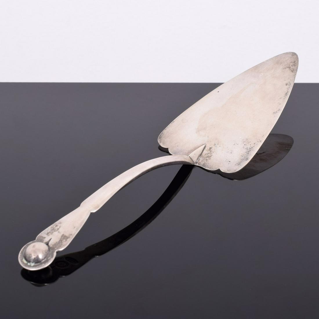William Spratling Pie Server: Artist/Designer; Manufacturer: William Spratling Marking(s); notes: signed, marking(s) Country of origin; materials: Mexico; sterling silver Dimensions (H, W, D): 10.5"l, 3"w; 17.54 Troy Ounces total 