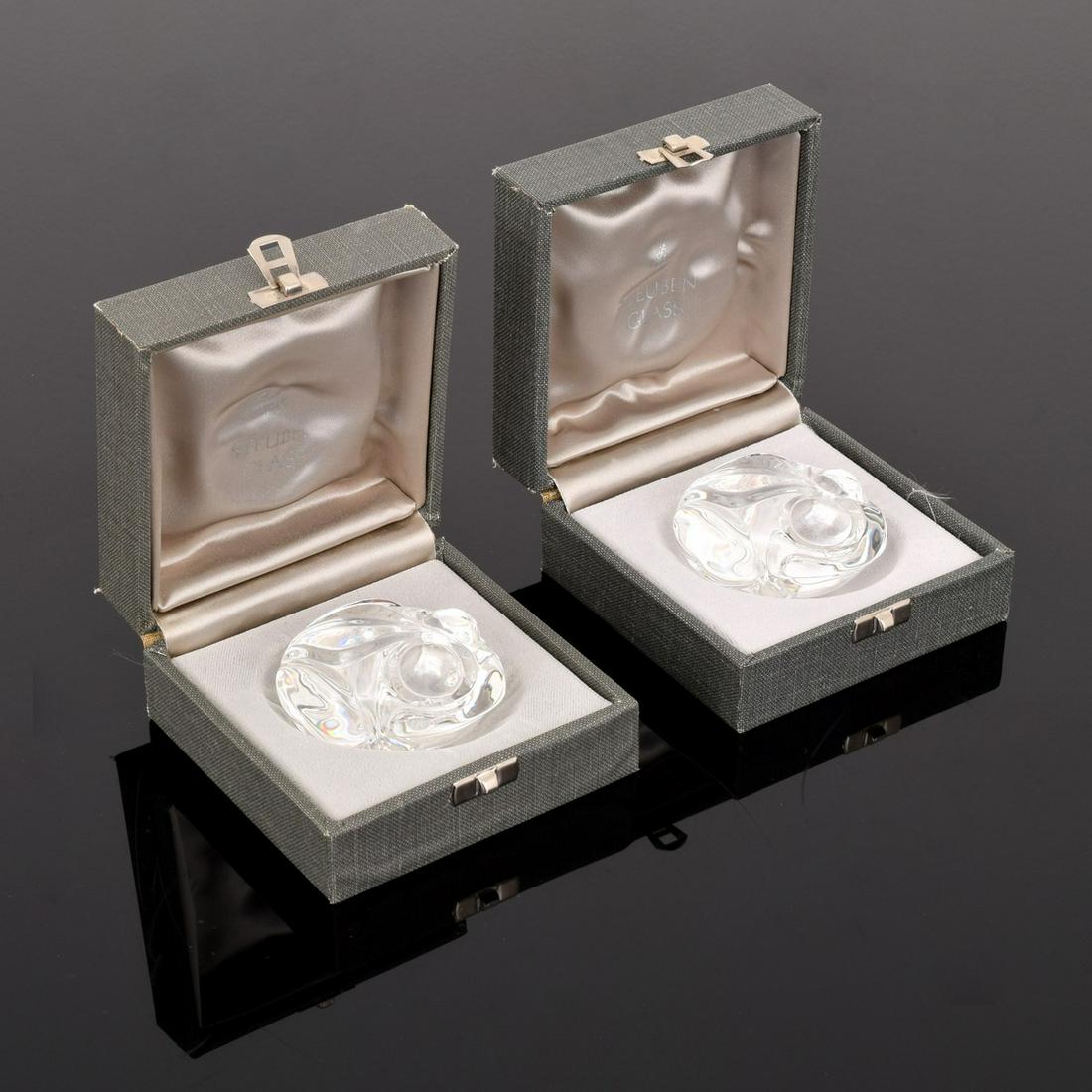 2 Steuben Frog Hand Coolers / Figurines: Artist/Designer; Manufacturer: Steuben Marking(s); notes: signed, marking(s) Country of origin; materials: France; glass Dimensions (H, W, D): 1.5"h, 2.5"w, 2"d; box: 2"h, 3.75"w, 3.75"d Additional In