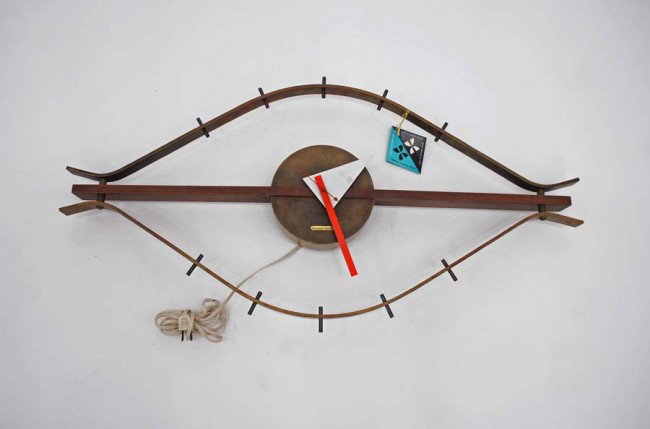 George Nelson Eye Clock: Designer & Manufacturer: George Nelson; Howard Miller Clock Co. Markings: label, hang tag Country of Origin & Materials: USA; brass, walnut, metal Additional Information & Circa: Fine & rare "eye" clo