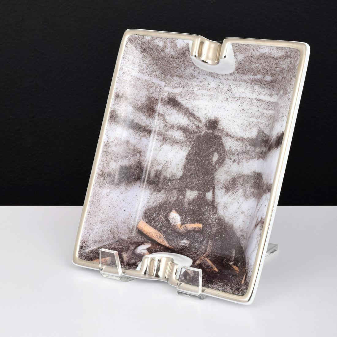 Vik Muniz "Wanderer Ashtray," Norton Family Project: Artist/Designer; Manufacturer: Vik Muniz (b. 1961) Marking(s); notes: marking(s); 1999 Country of origin; materials: Brazilian; glazed porcelain with hand-painted silver trim Dimensions (H, W, D): tra