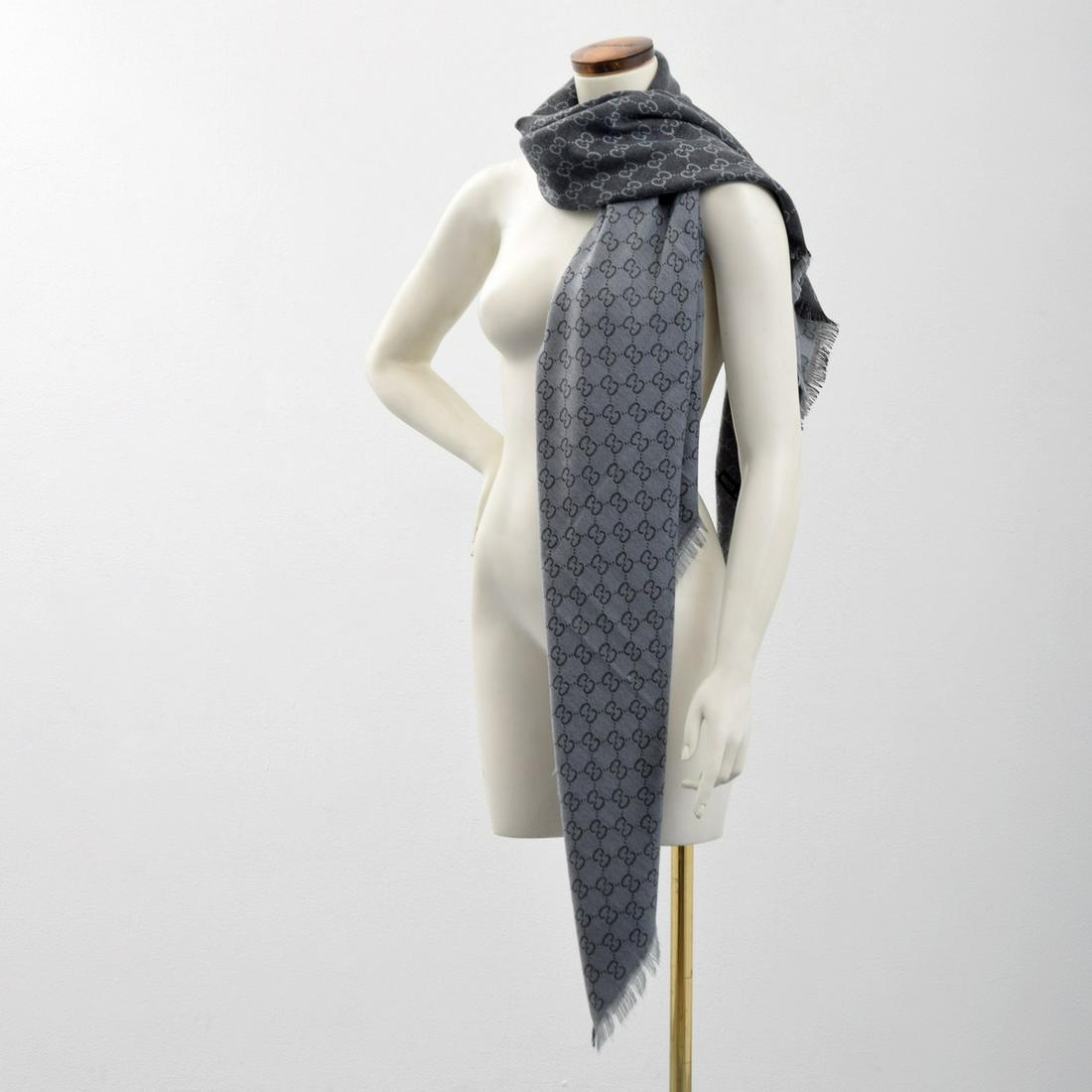 Gucci GG Monogram Wool & Cashmere Shawl / Scarf: Artist/Designer; Manufacturer: Gucci Marking(s); notes: Gucci monogram and tag Country of origin; materials: Italy; wool, cashmere Dimensions (H, W, D): 56"l, 56"w Additional Information: Lot includes