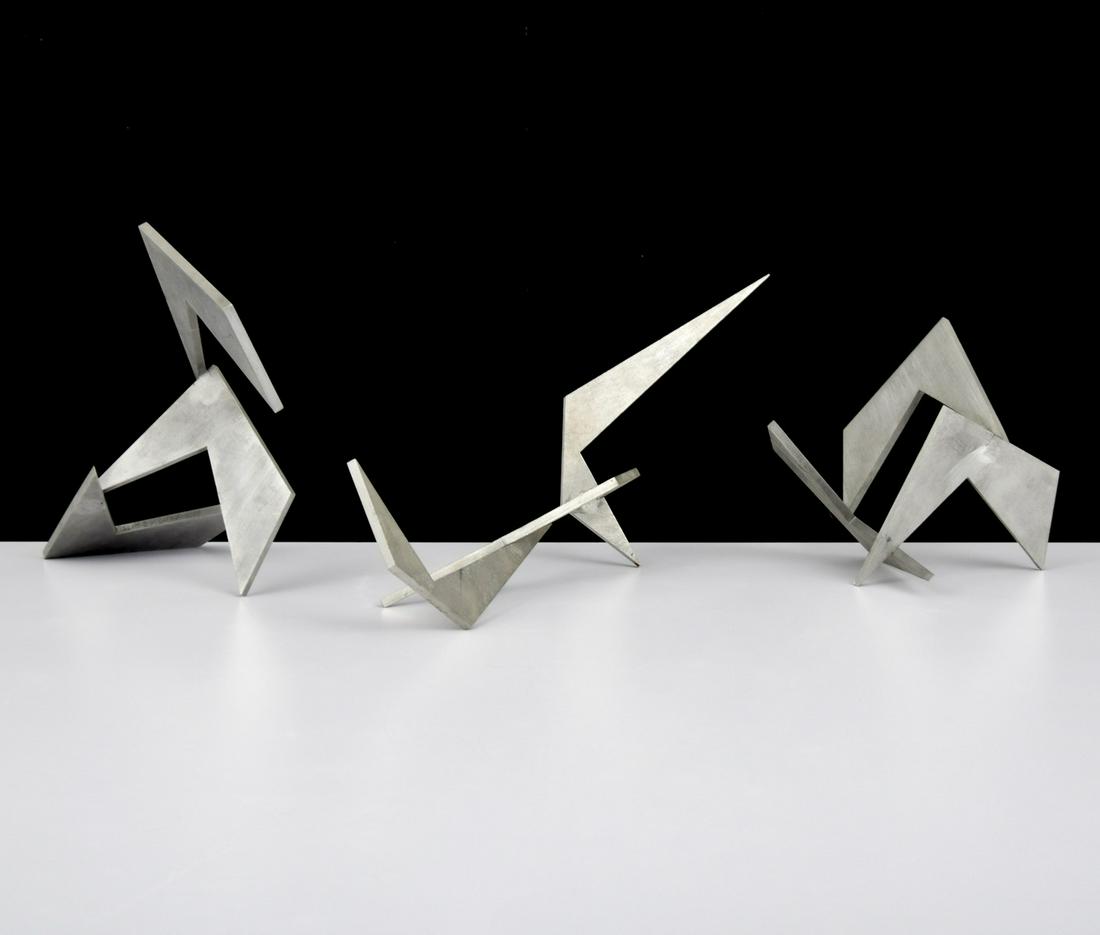 3 Larry Mohr Abstract Sculptures: Artist/Designer; Manufacturer: Larry Mohr (1921-2013) Marking(s); notes: signed, marking(s) Country of origin; materials: American; aluminum Dimensions (H, W, D): largest: 3.25"h, 17.75"w, 8"d Additio