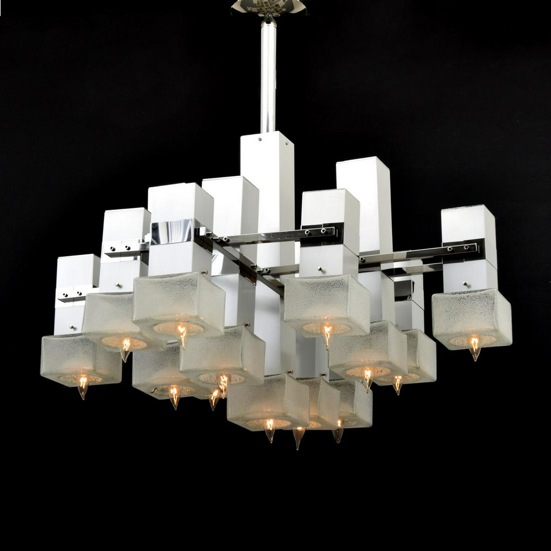 Gaetano Sciolari Chandelier: Artist/Designer; Manufacturer: Gaetano Sciolari Marking(s); notes: no marking(s) apparent Country of origin; materials: Italy; metal, glass Dimensions (H, W, D): 34"h, 34.5"w, 27"d Additional Informat