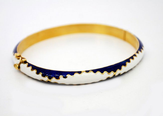 Enamel and Gold 18k Bracelet: Designer & Manufacturer: Country of Origin & Materials: Italy; gold, enamel Additional Information & Circa: Enamel and 18k gold bangle bracelet Dimensions: 2.5" Dia. (exterior); Weight 21.3G