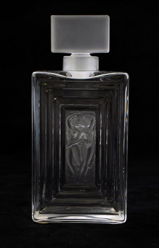 Perfume Bottle by Lalique: Designer & Manufacturer: Lalique Markings: signed Country of Origin & Materials: France; crystal Additional Information & Circa: Flacon Duncan perfume bottle No. 3 by Lalique; 20th Century Dimensions(