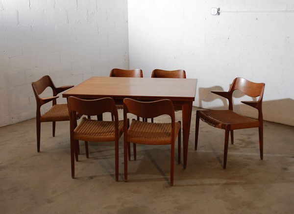 Niels O. Moller Dining Table & 6 Chairs: Designer & Manufacturer: Niels O. Moller; J.L. Moller Markings: label Country of Origin & Materials: Denmark; teak, woven fiber Additional Information & Circa: Fine extension (self storing) dining tab