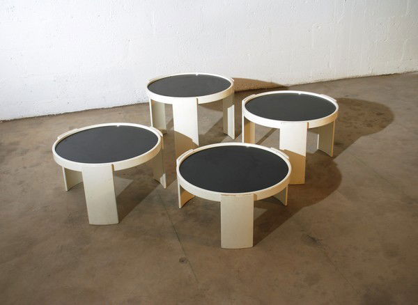 Gianfranco Frattini Nesting Tables, Set of 4: Designer & Manufacturer: Gianfranco Frattini; Cassina Markings: label Country of Origin & Materials: Italy; beech, laminate Additional Information & Circa: Set of 4 large size nesting tables with reve