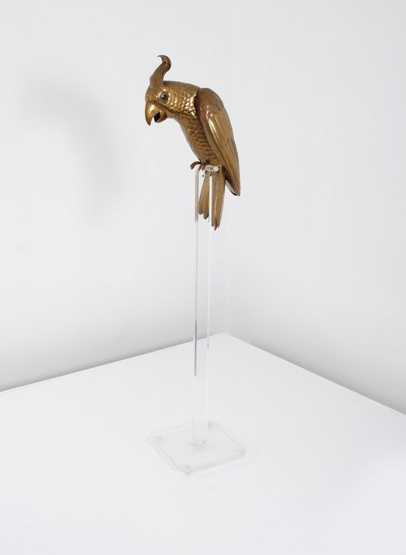 Sergio Bustamante Bird on Stand: Designer & Manufacturer: Sergio Bustamante Markings: none Country of Origin & Materials: Mexico; brass, lucite Additional Information & Circa: Brass bird on lucite stand by Sergio Bustamante; c. 1970 