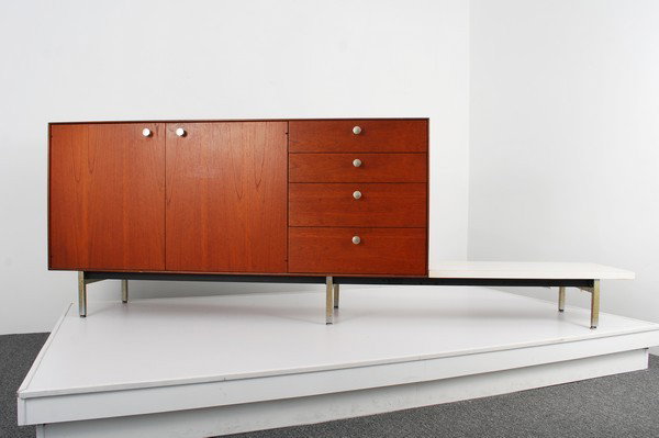 George Nelson "Thin Edge" Cabinet: Designer & Manufacturer: George Nelson; Herman Miller Markings: marked Country of Origin & Materials: USA; teak, metal, mica Additional Information & Circa: Early cabinet with 4 drawers, 2 doors revea