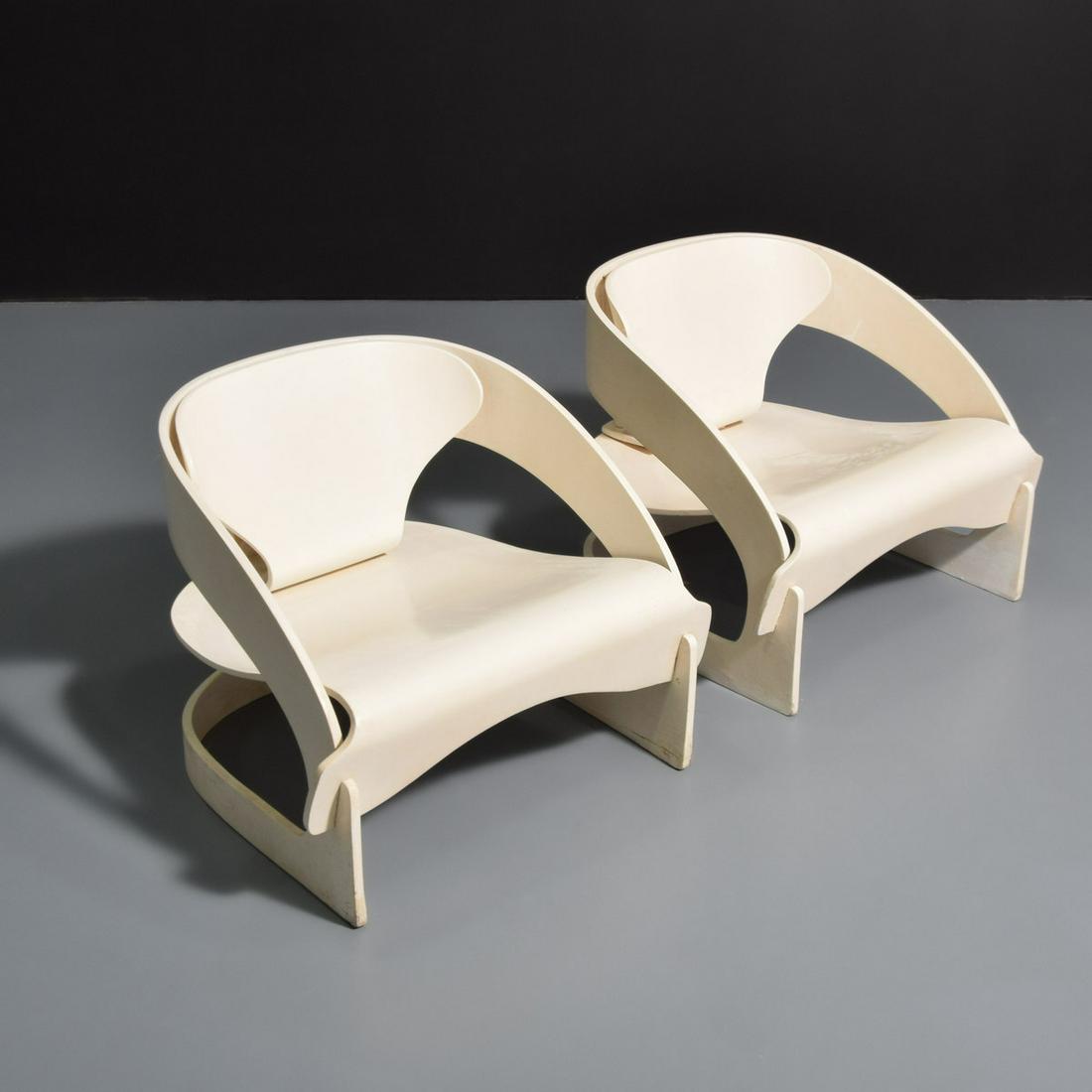 Pair of Joe Colombo 4801 Lounge Chairs: Artist/Designer; Manufacturer: Joe Colombo; Kartell Marking(s); notes: marking(s); 1963 Country of origin; materials: Italy; lacquered plywood Dimensions (H, W, D): 23"h, 28.5"w, 28"d; 13.5"seat heigh