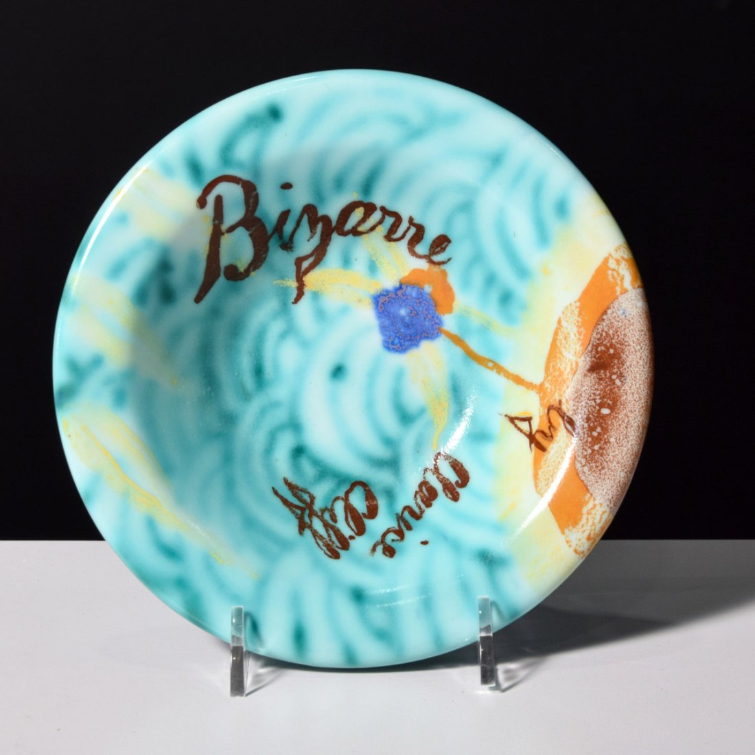 Clarice Cliff INSPIRATION Bizarre Bowl: Artist/Designer; Manufacturer: Clarice Cliff; Wilkinson Ltd. Marking(s); notes: signed, marking(s) Country of origin; materials: England; hand painted ceramic Dimensions (H, W, D): 1.75"h, 6.5"dia Add