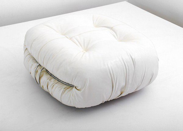 Pair of Tobia Scarpa "Soriana" Ottomans: Designer & Manufacturer: Tobia Scarpa; Cassina Markings: marked Country of Origin & Materials: Italy; leather, chrome plated steel Additional Information & Circa: Pair of leather "Soriana" ottomans on