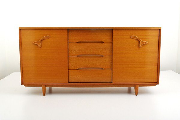 Dresser by Paul Laszlo: Designer & Manufacturer: Paul Laszlo; Brown Saltman Markings: marked Country of Origin & Materials: USA; walnut, plastic Additional Information & Circa: Dresser/cabinet with 4 drawers and 2 doors one