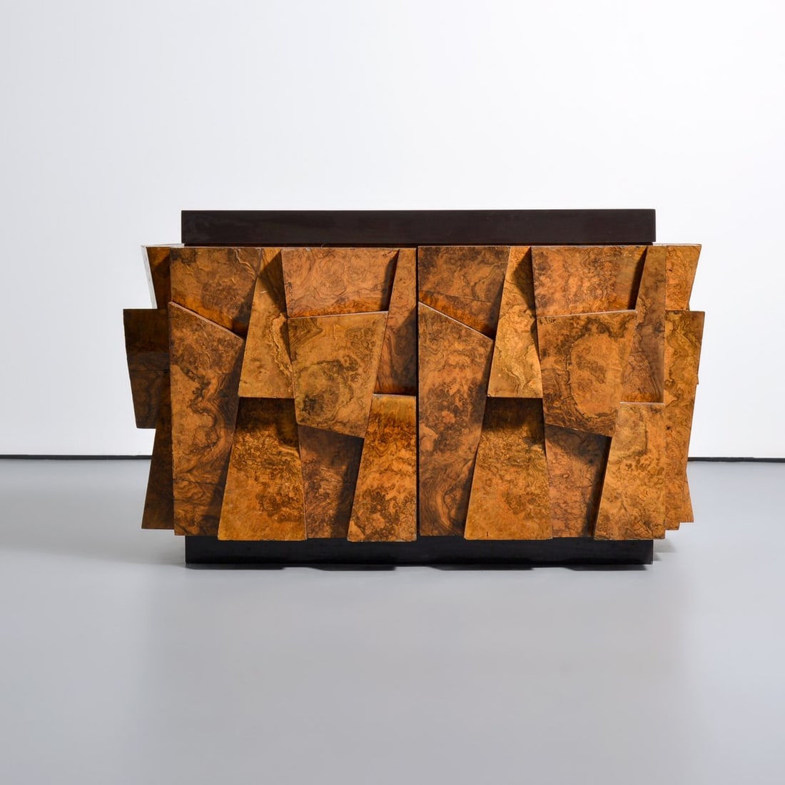 Rare Paul Evans Faceted Cabinet: Artist/Designer; Manufacturer: Paul Evans (American, 1931-1987); Paul Evans Studio for Directional (USA) Marking(s); notes: no marking(s) apparent Materials: burl wood, lacquered fiberglass Dimensions